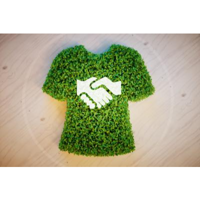 Image of a t-shirt made of plants with shaking hands imprinted on it