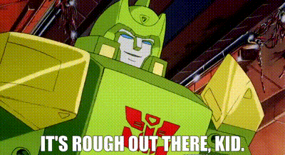 Gif of a Transformer speaking to a kid with the subtitles reading "It's rough out there, kid"